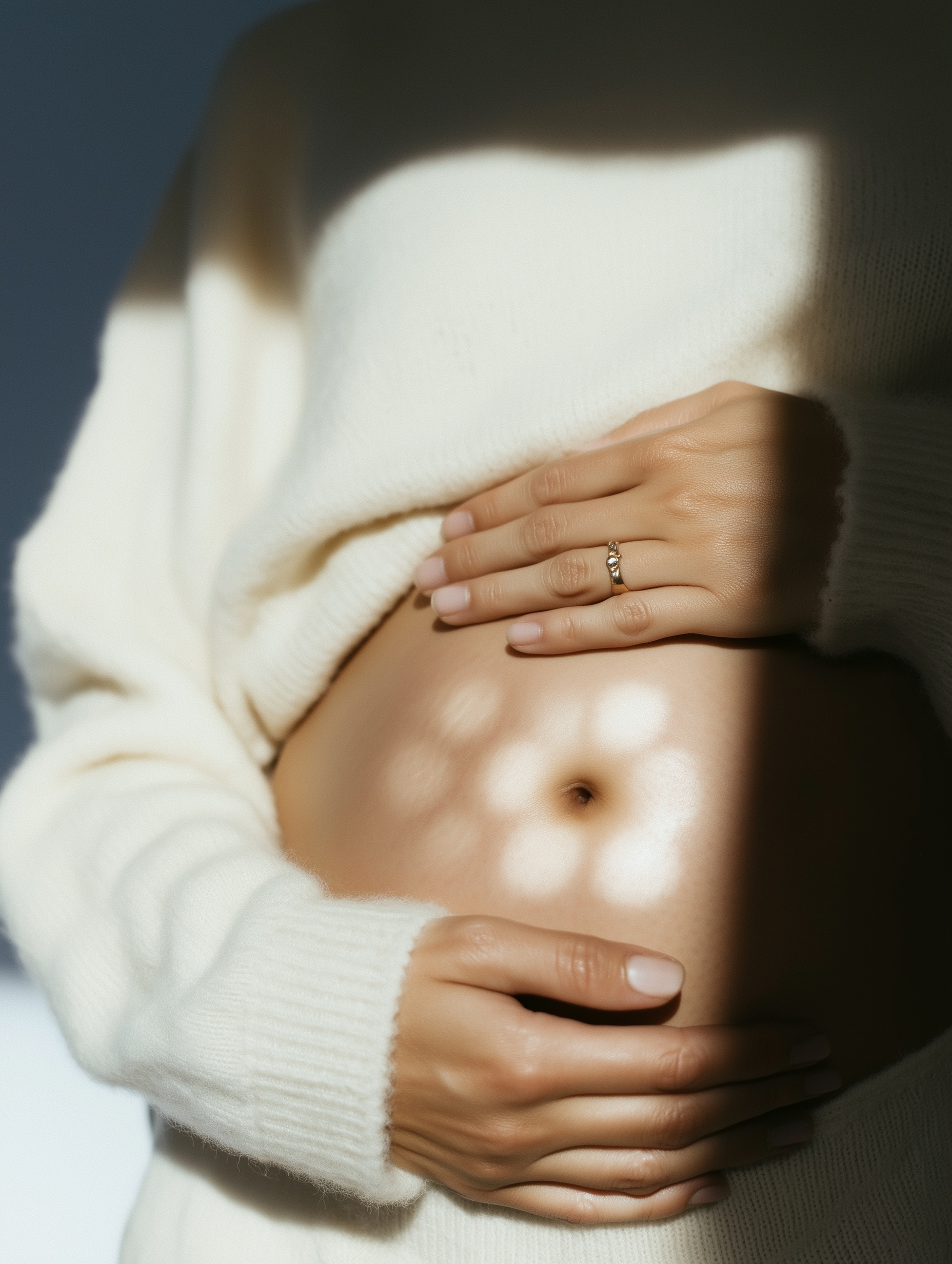 Pregnant woman cradling bump - Lotus Fertility